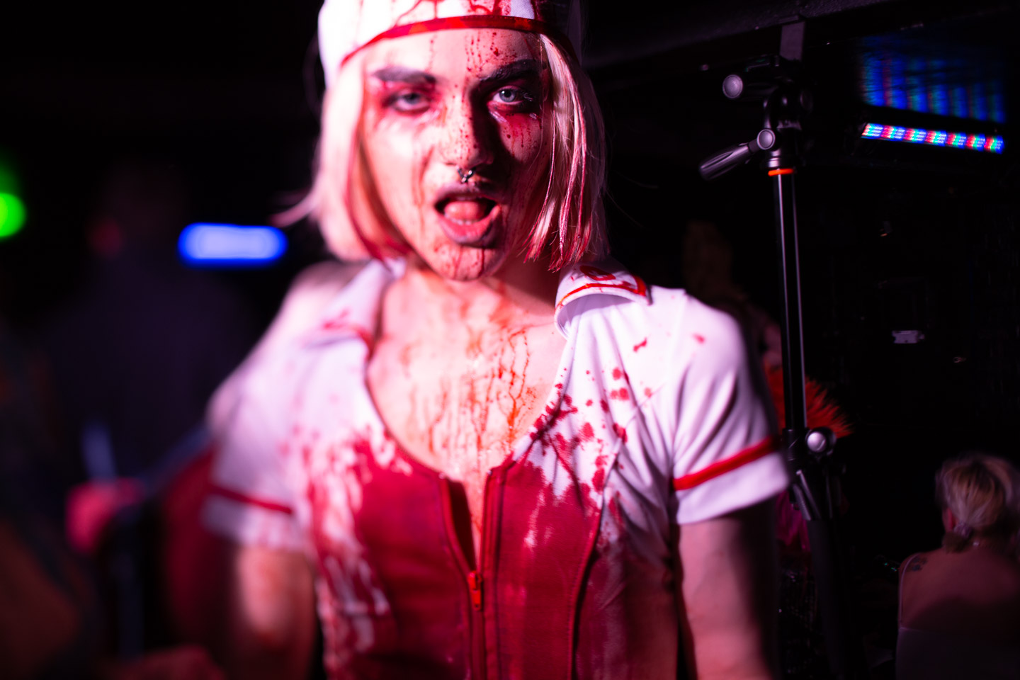 Kyran Thrax in a nurse uniform dripping with blood